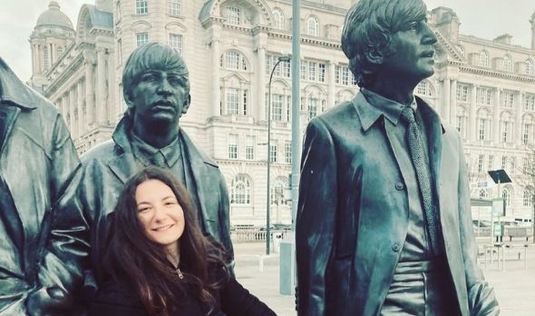 Girl with the Beatles statues