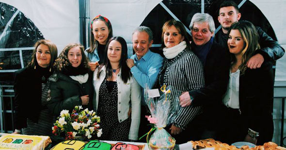 Students with a host family at a celebration
